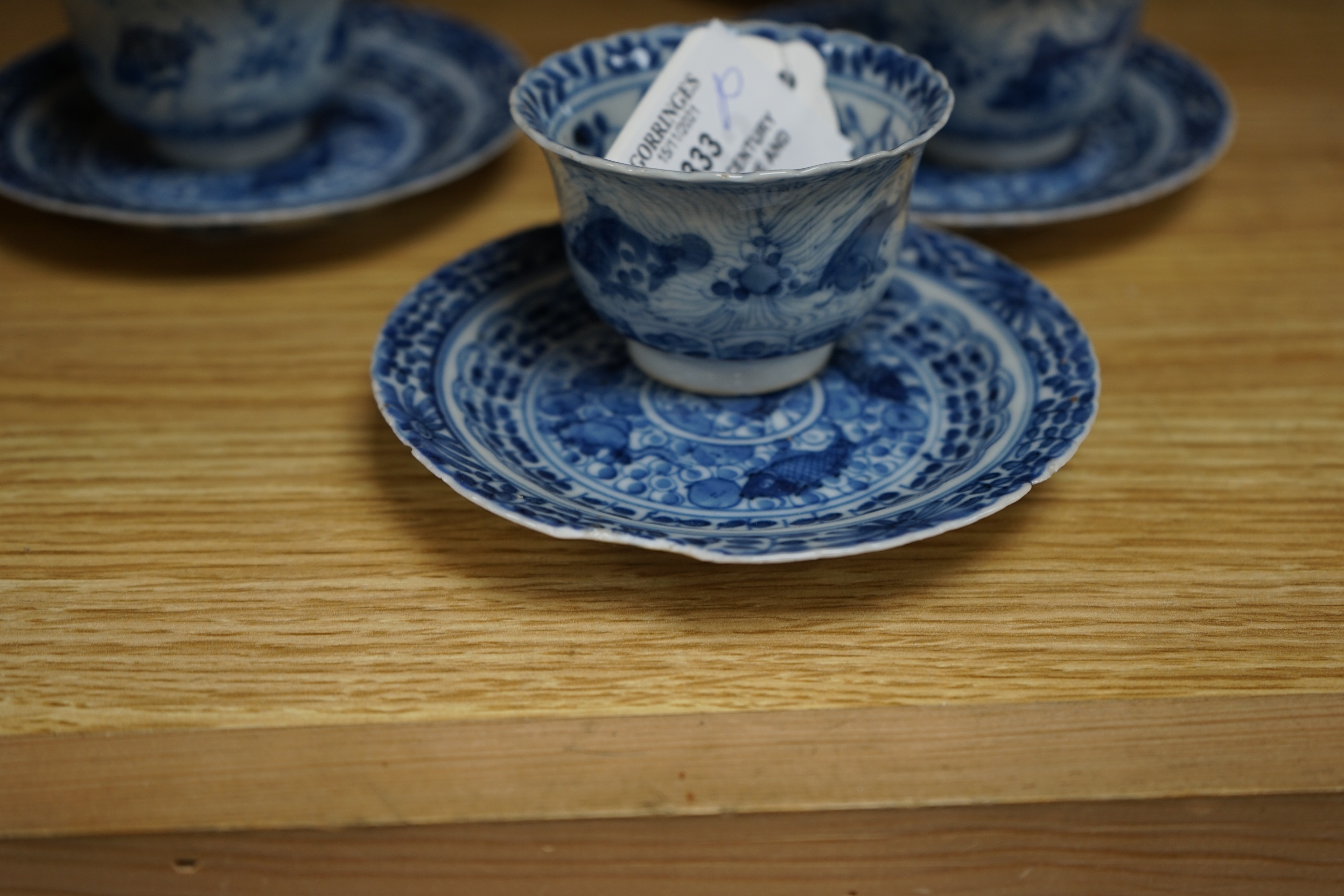 Five 19th century Chinese blue and white tea bowls and saucers, four-character marks to bases